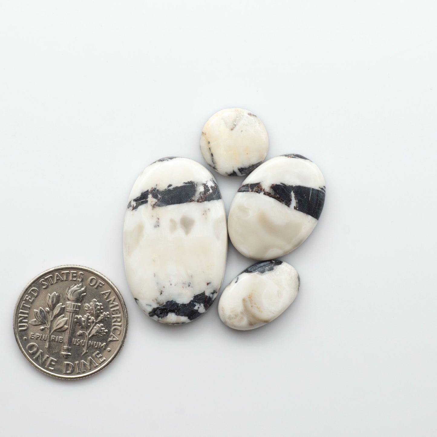 Natural White Buffalo Stone Cabochons are semi-precious gemstones cut into shapes ideal for jewelry-making, making them an excellent choice for artisans.

