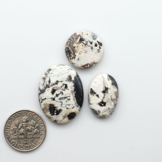 Natural White Buffalo Stone Cabochons are semi-precious gemstones cut into shapes ideal for jewelry-making, making them an excellent choice for artisans.

