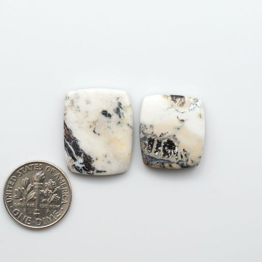 Natural White Buffalo Stone Cabochons are semi-precious gemstones cut into shapes ideal for jewelry-making, making them an excellent choice for artisans.

