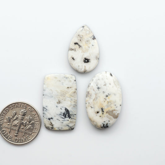 Natural White Buffalo Stone Cabochons are semi-precious gemstones cut into shapes ideal for jewelry-making, making them an excellent choice for artisans.

