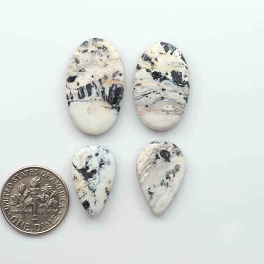 Natural White Buffalo Stone Cabochons are semi-precious gemstones cut into shapes ideal for jewelry-making, making them an excellent choice for artisans.