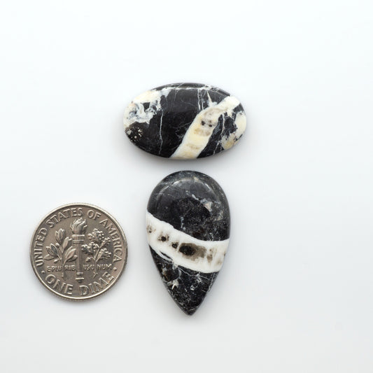 Natural White Buffalo Stone Cabochons are semi-precious gemstones cut into shapes ideal for jewelry-making, making them an excellent choice for artisans.