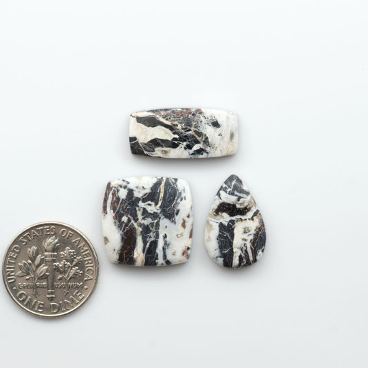 Natural White Buffalo Stone Cabochons are semi-precious gemstones cut into shapes ideal for jewelry-making, making them an excellent choice for artisans.