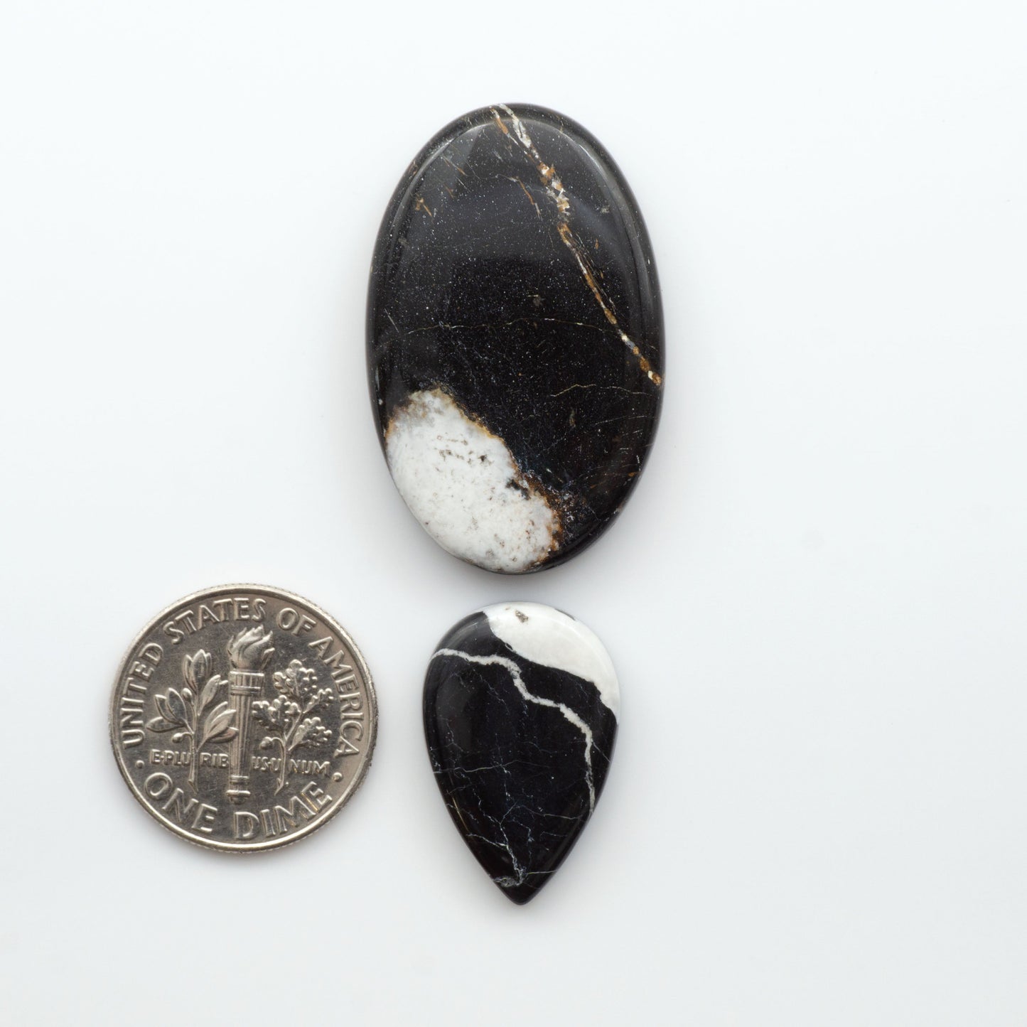 Natural White Buffalo Stone Cabochons are semi-precious gemstones cut into shapes ideal for jewelry-making, making them an excellent choice for artisans.