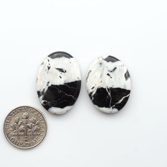 Natural White Buffalo Stone Cabochons are semi-precious gemstones cut into shapes ideal for jewelry-making, making them an excellent choice for artisans.