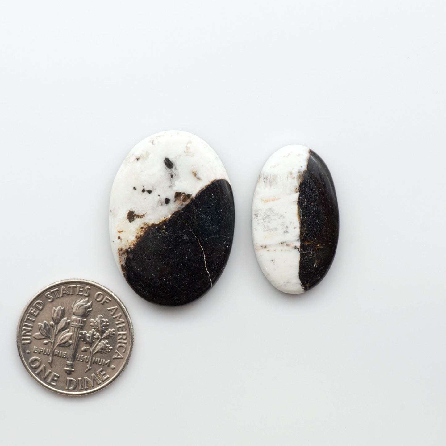Natural White Buffalo Stone Cabochons are semi-precious gemstones cut into shapes ideal for jewelry-making, making them an excellent choice for artisans.