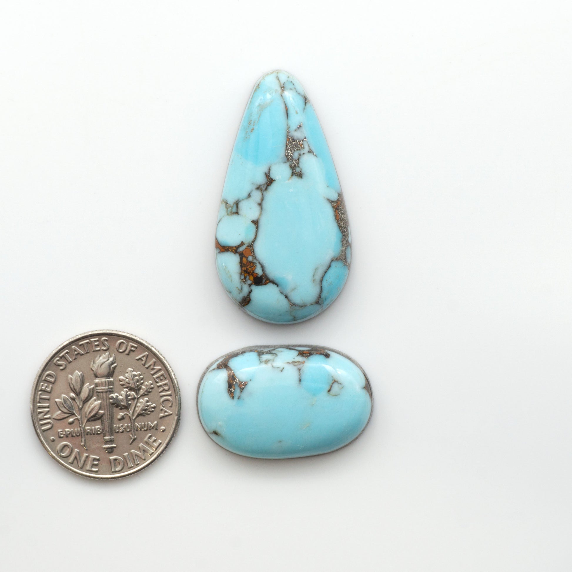 Enhance your jewelry designs with Pressed Turquoise Nugget Cabochons. Crafted from composite materials they add a captivating touch to your creations.

