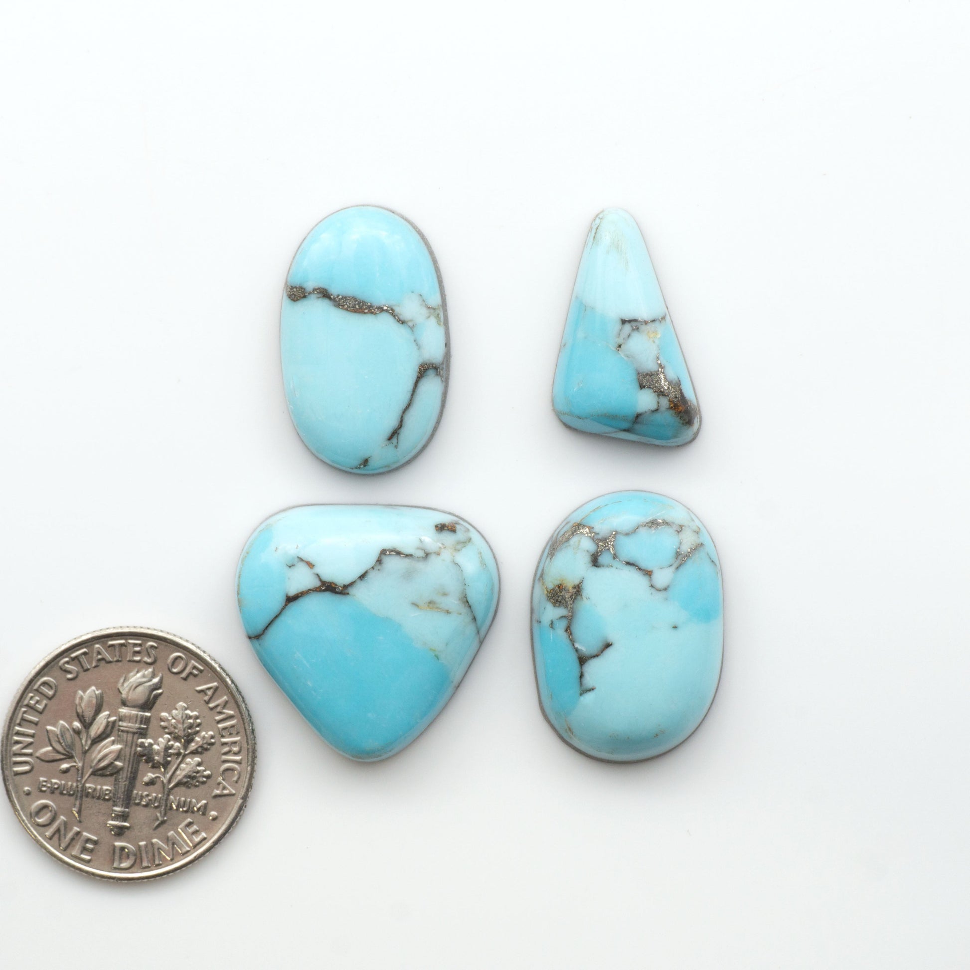 Enhance your jewelry designs with Pressed Turquoise Nugget Cabochons. Crafted from composite materials they add a captivating touch to your creations.

