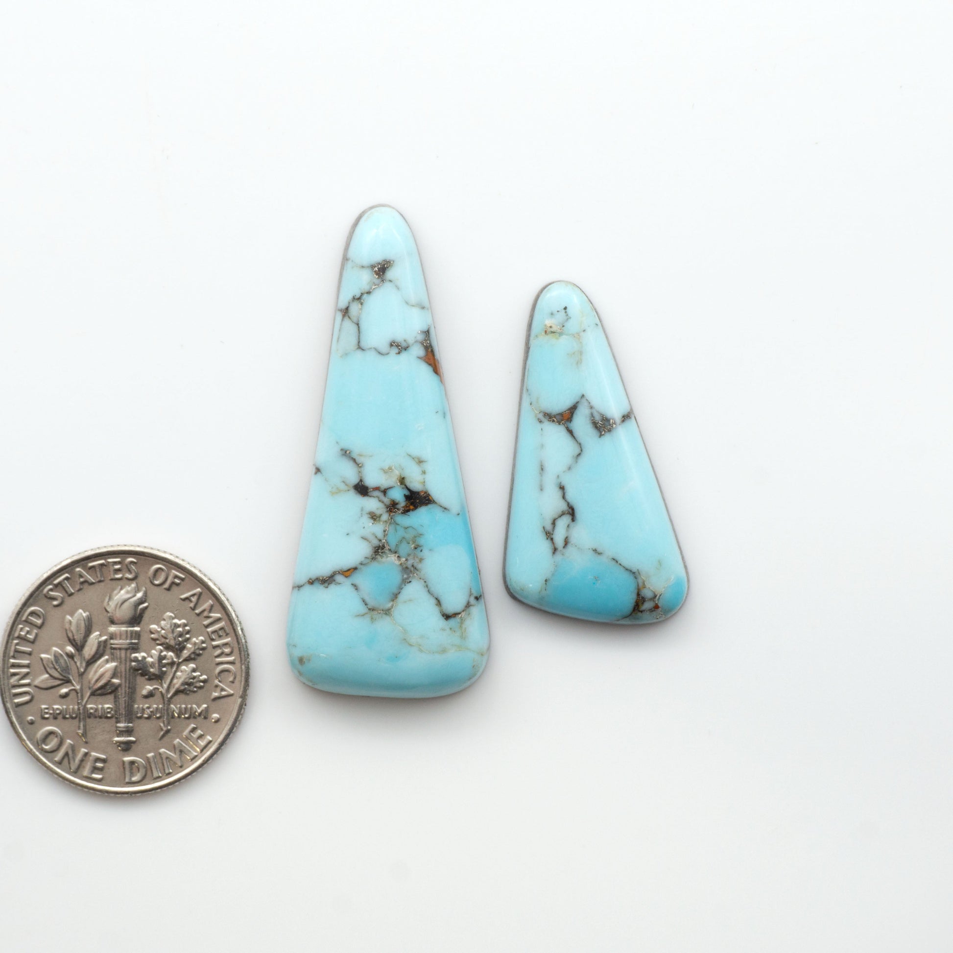Enhance your jewelry designs with Pressed Turquoise Nugget Cabochons. Crafted from composite materials they add a captivating touch to your creations.


