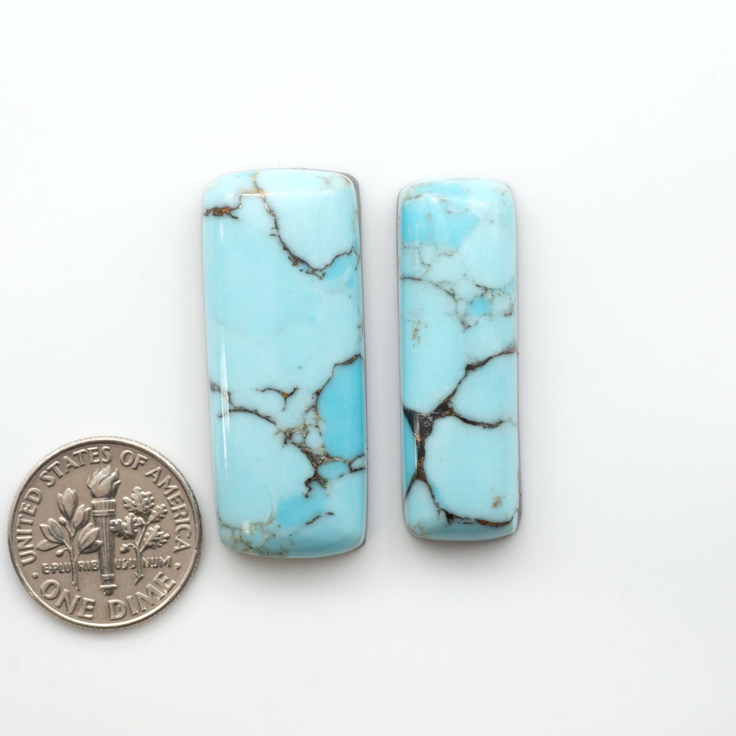 Enhance your jewelry designs with Pressed Turquoise Nugget Cabochons. Crafted from composite materials they add a captivating touch to your creations.

