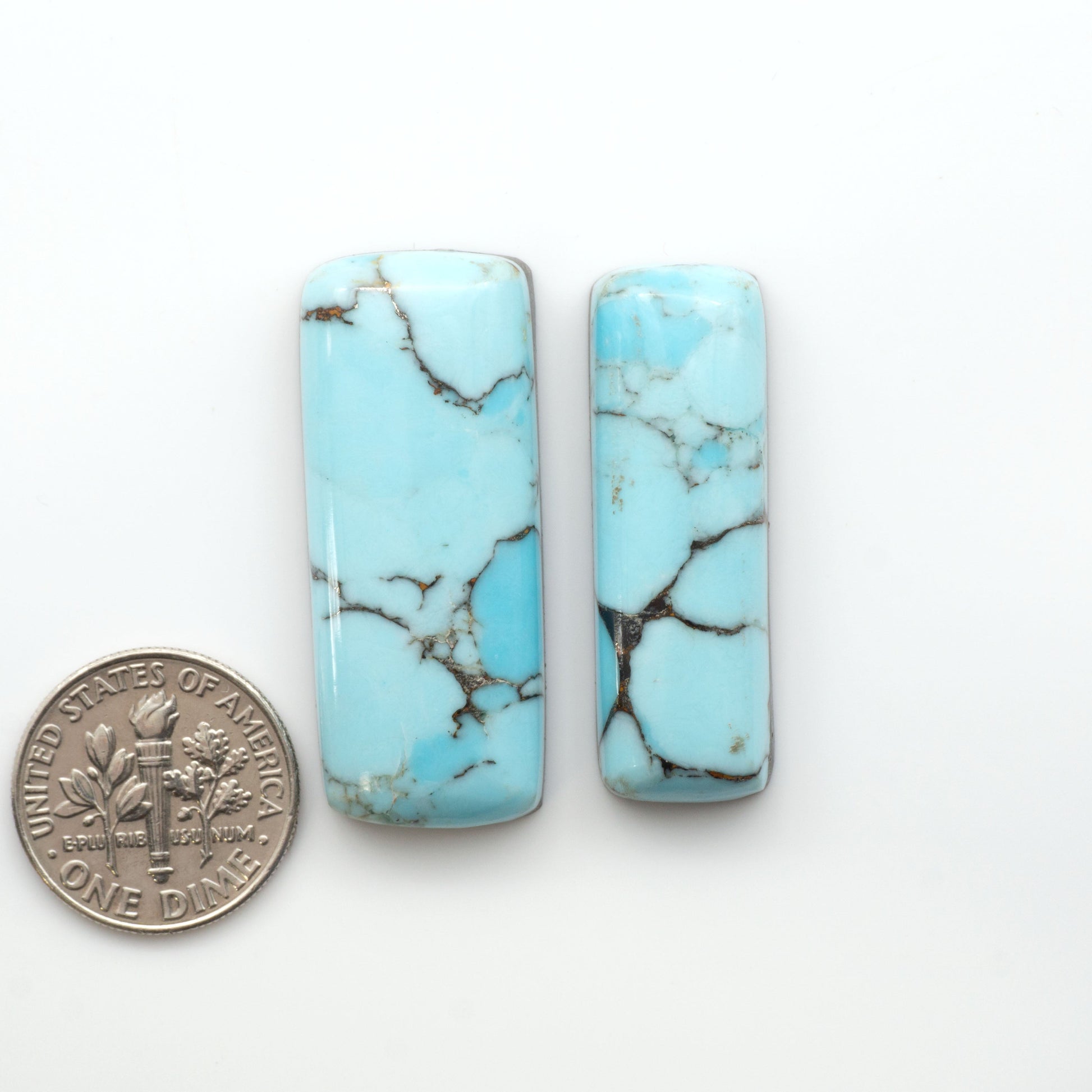 Enhance your jewelry designs with Pressed Turquoise Nugget Cabochons. Crafted from composite materials they add a captivating touch to your creations.

