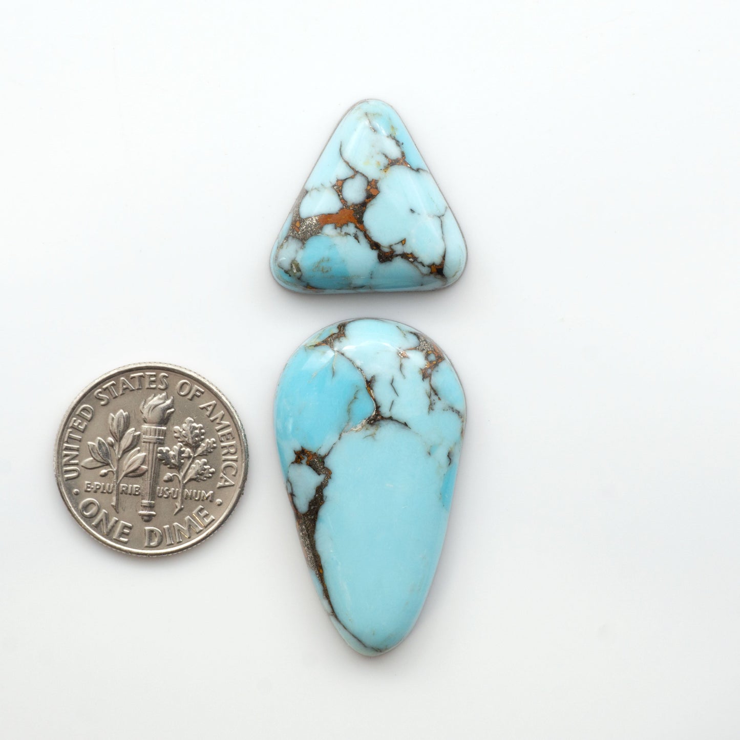 Enhance your jewelry designs with Pressed Turquoise Nugget Cabochons. Crafted from composite materials they add a captivating touch to your creations.

