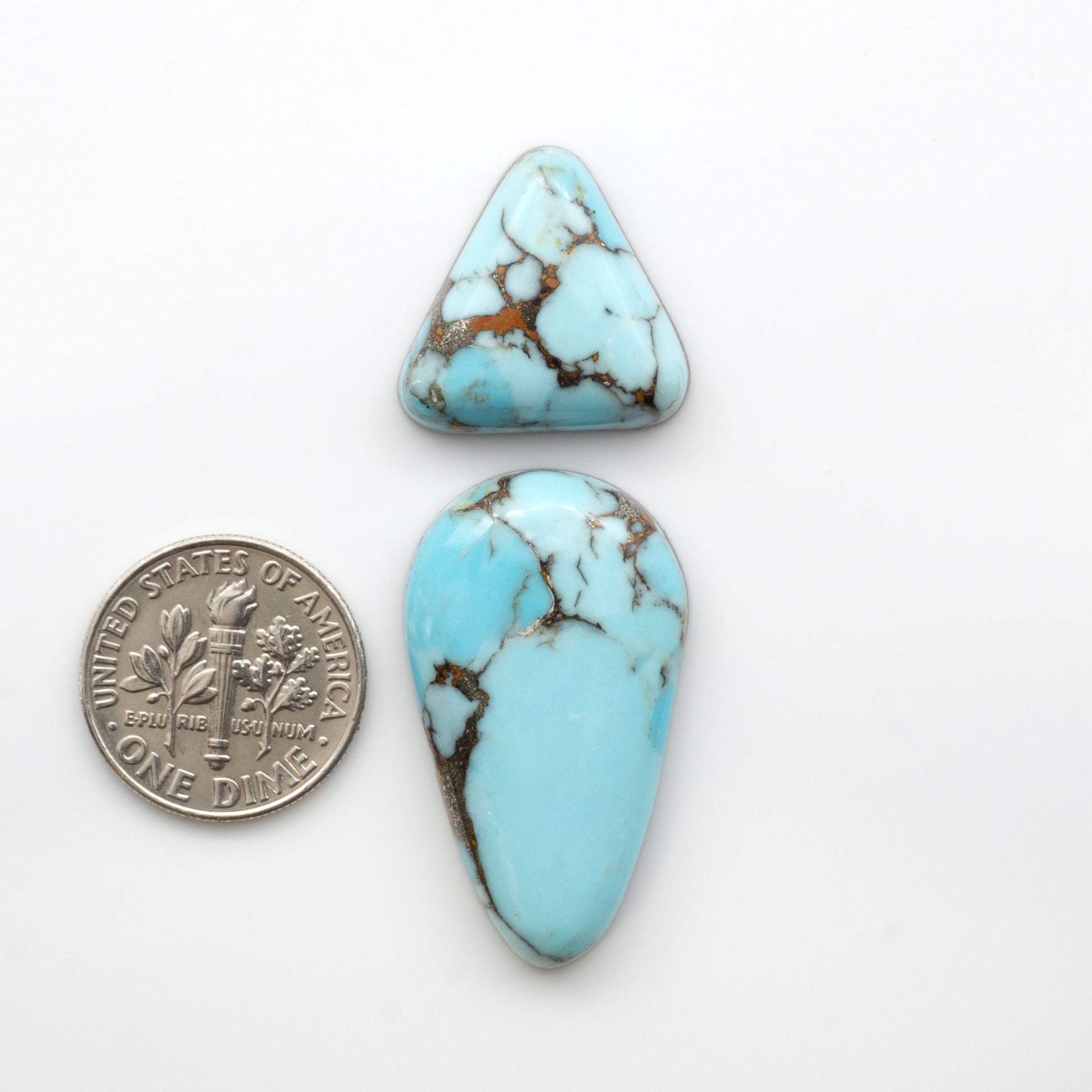 Enhance your jewelry designs with Pressed Turquoise Nugget Cabochons. Crafted from composite materials they add a captivating touch to your creations.

