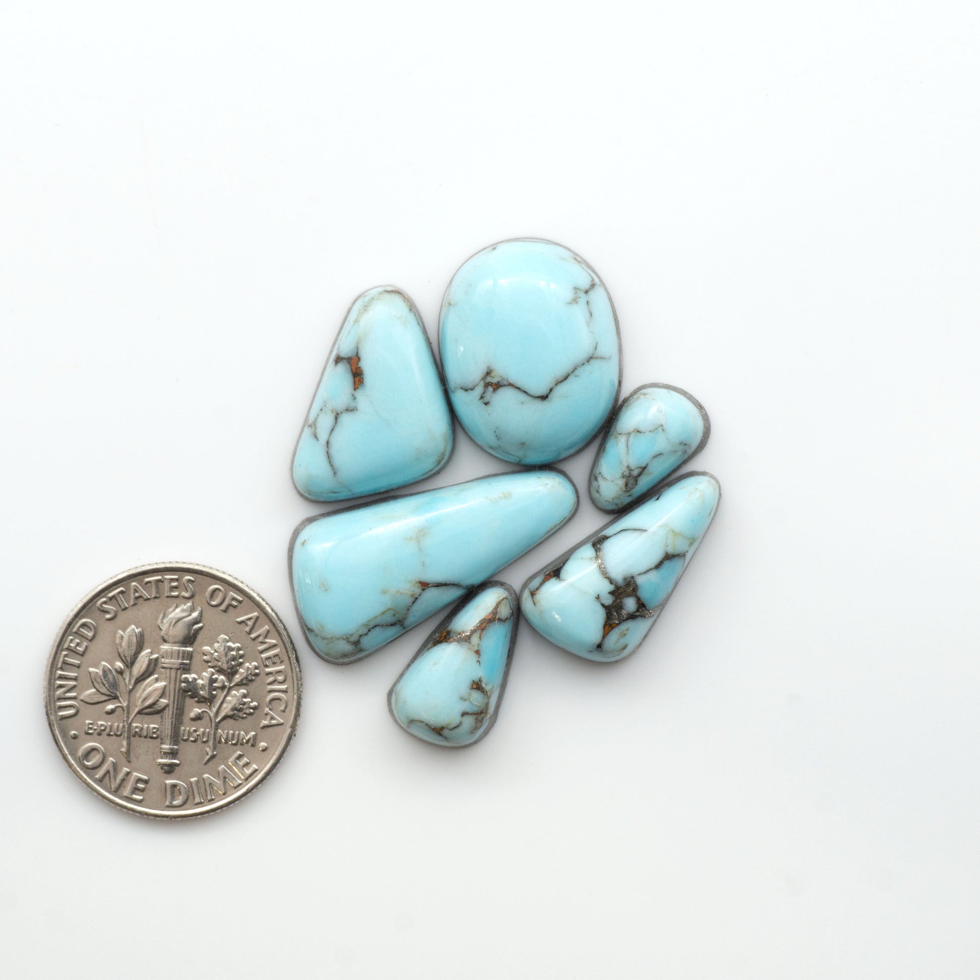 Enhance your jewelry designs with Pressed Turquoise Nugget Cabochons. Crafted from composite materials they add a captivating touch to your creations.

