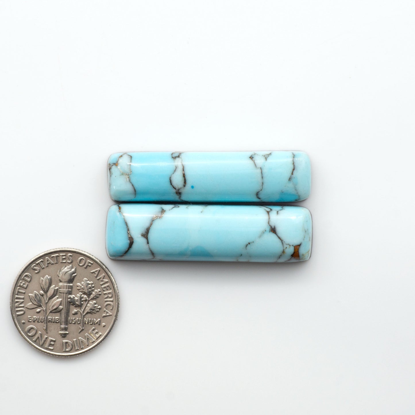 Enhance your jewelry designs with Pressed Turquoise Nugget Cabochons. Crafted from composite materials they add a captivating touch to your creations.

