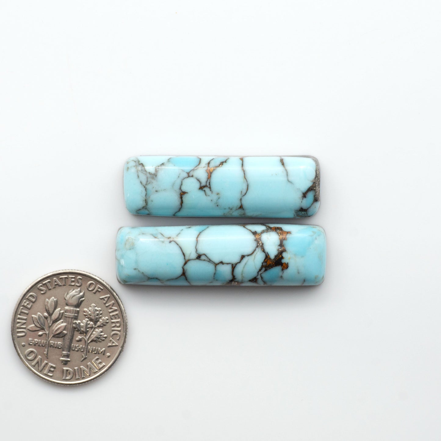 Enhance your jewelry designs with Pressed Turquoise Nugget Cabochons. Crafted from composite materials they add a captivating touch to your creations.


