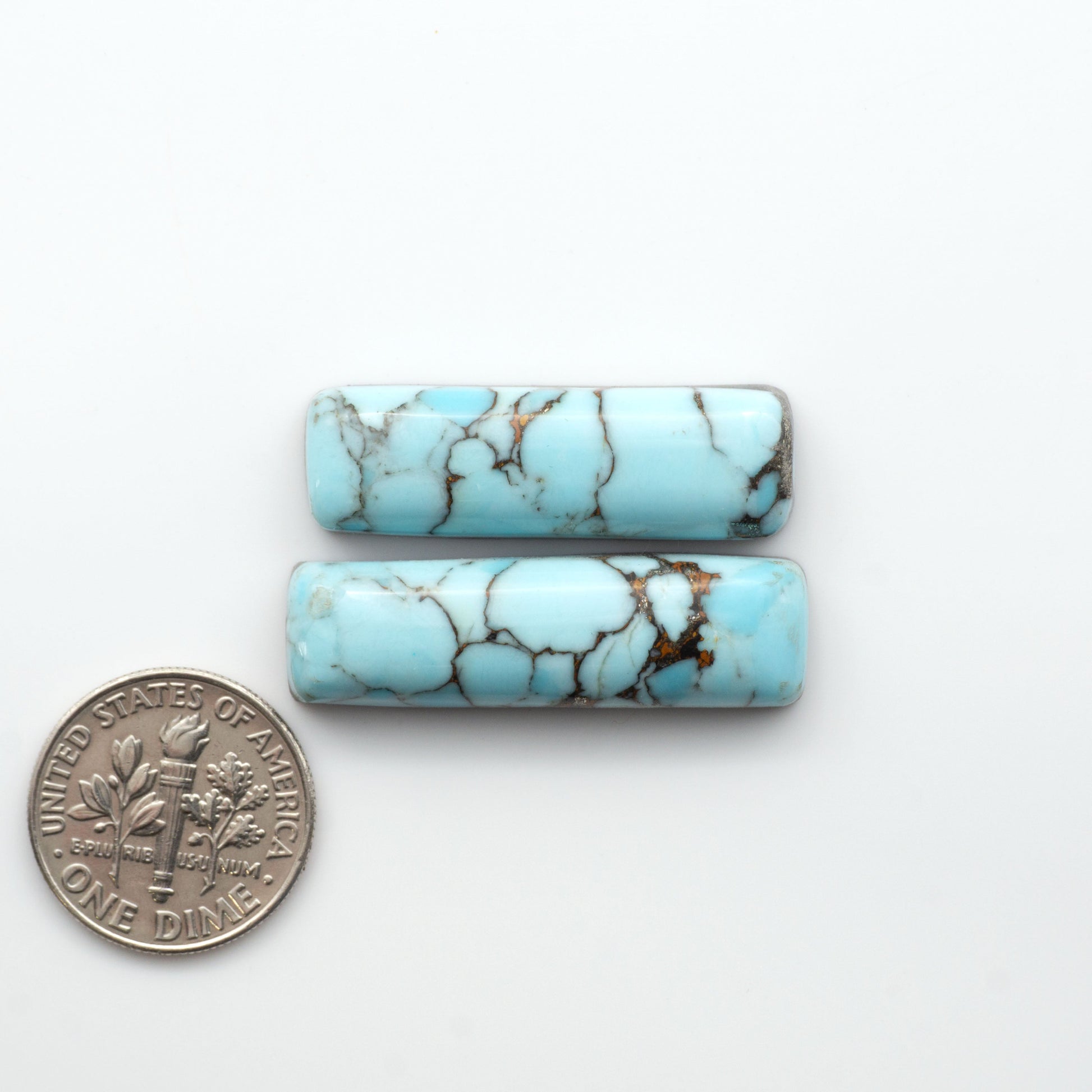 Enhance your jewelry designs with Pressed Turquoise Nugget Cabochons. Crafted from composite materials they add a captivating touch to your creations.

