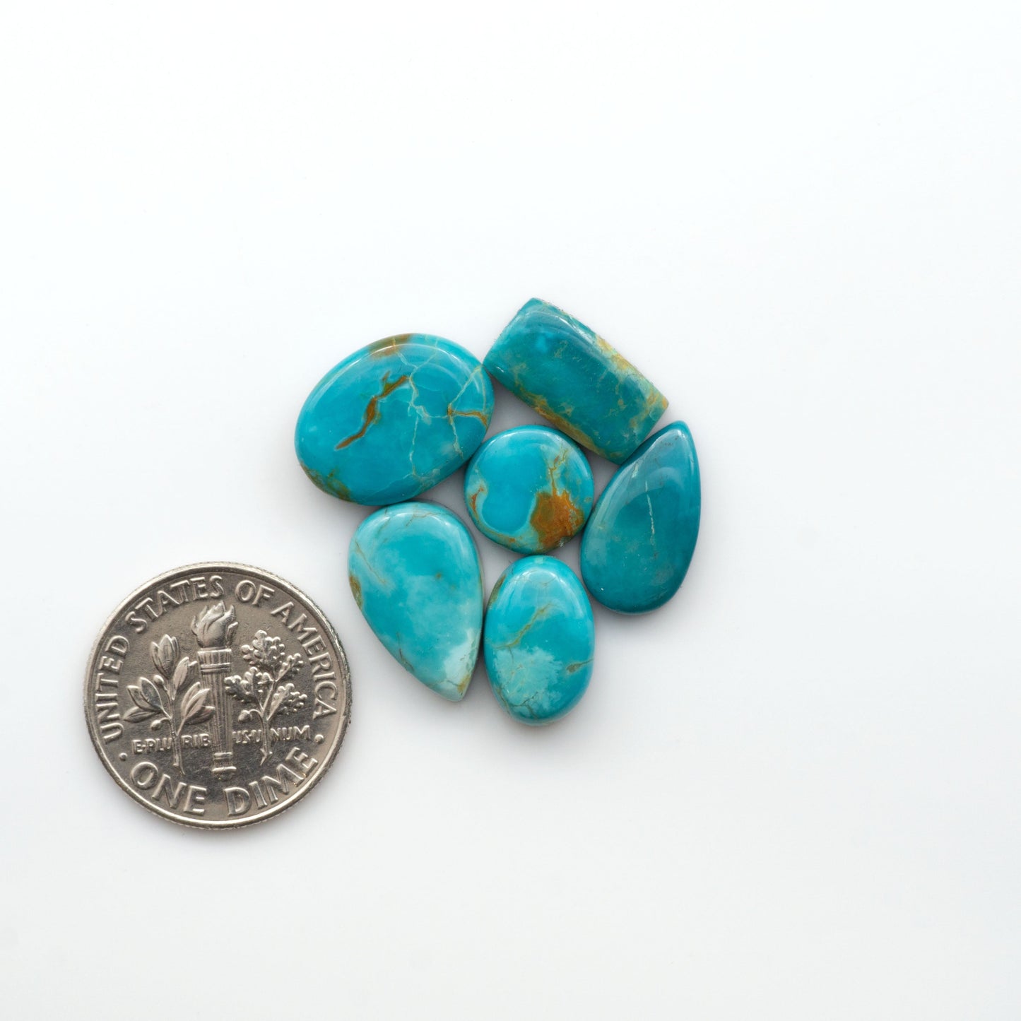 Add a touch of beauty to your collection with our stunning Pilot Mountain Turquoise Cabochons. Perfect for jewelry making each piece is truly one-of-a-kind.

