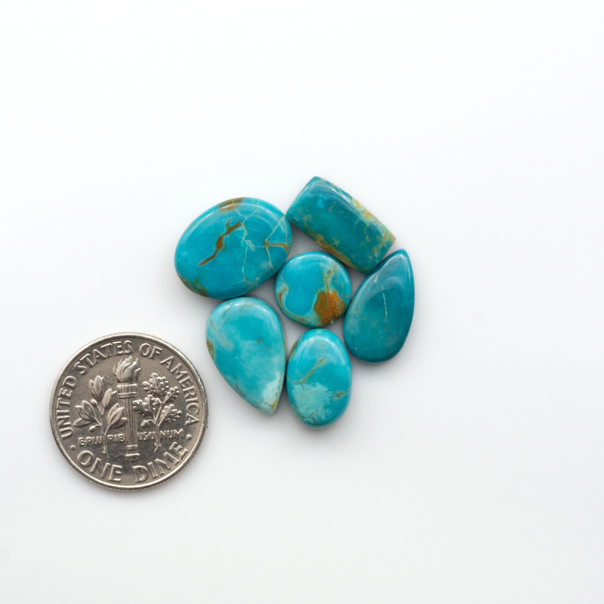 Add a touch of beauty to your collection with our stunning Pilot Mountain Turquoise Cabochons. Perfect for jewelry making each piece is truly one-of-a-kind.

