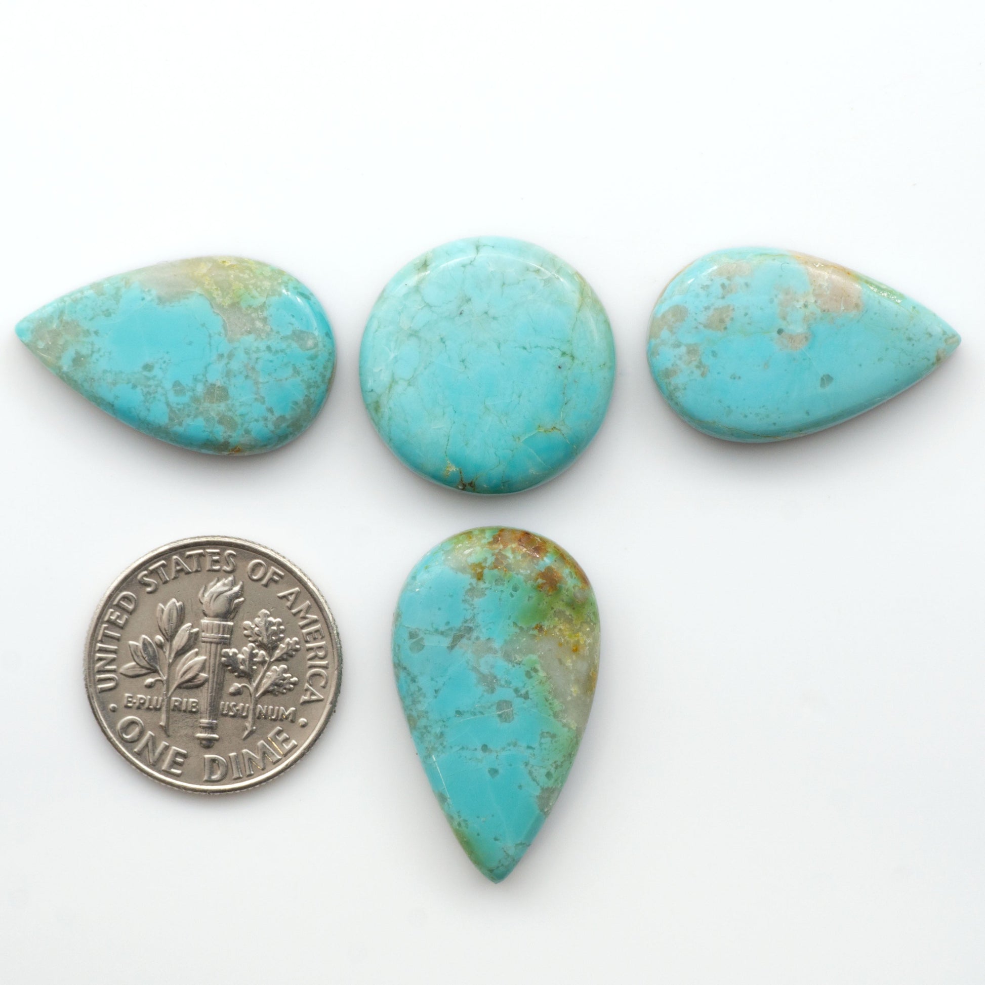 Add a touch of beauty to your collection with our stunning Pilot Mountain Turquoise Cabochons. Perfect for jewelry making each piece is truly one-of-a-kind.

