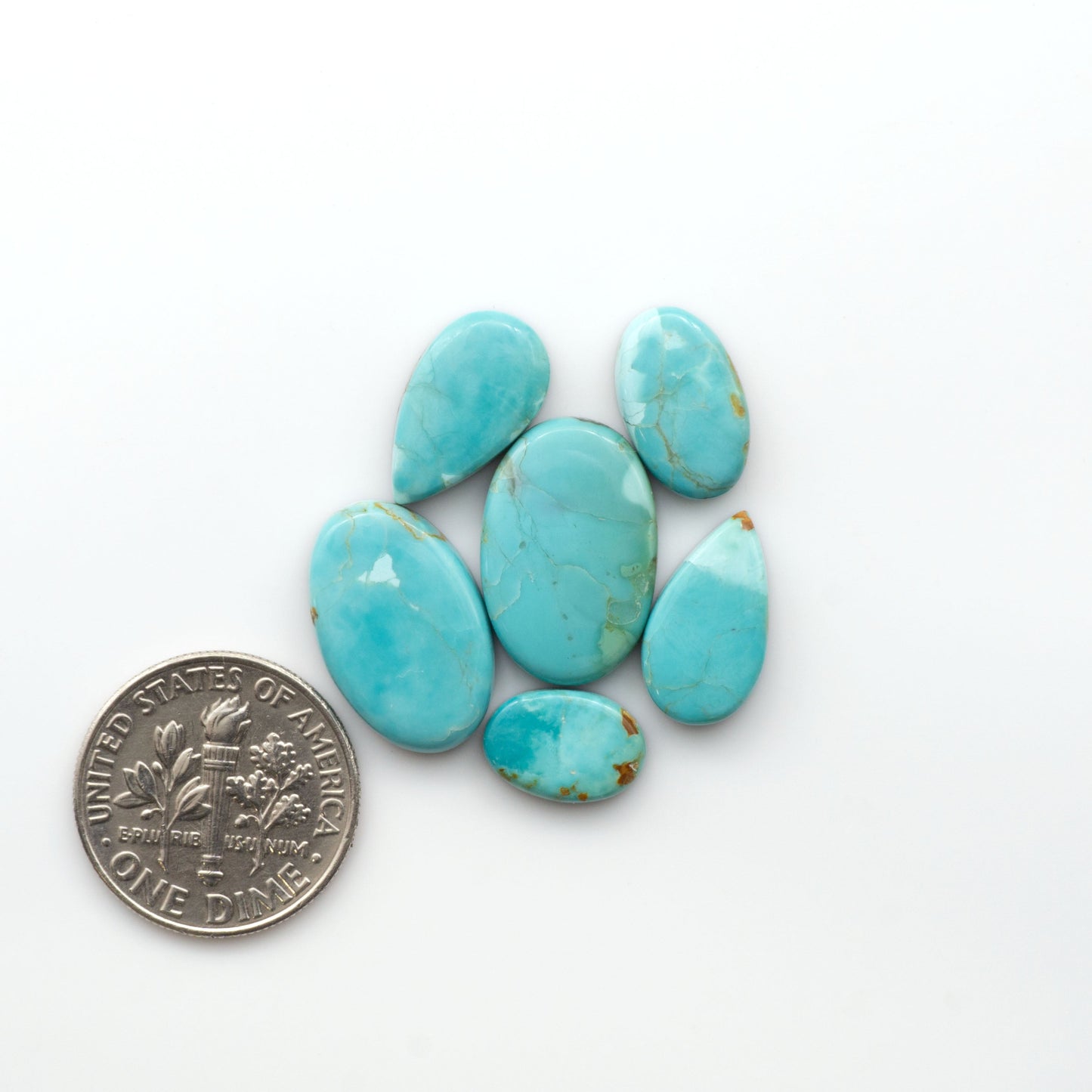 Add a touch of beauty to your collection with our stunning Pilot Mountain Turquoise Cabochons. Perfect for jewelry making each piece is truly one-of-a-kind.

