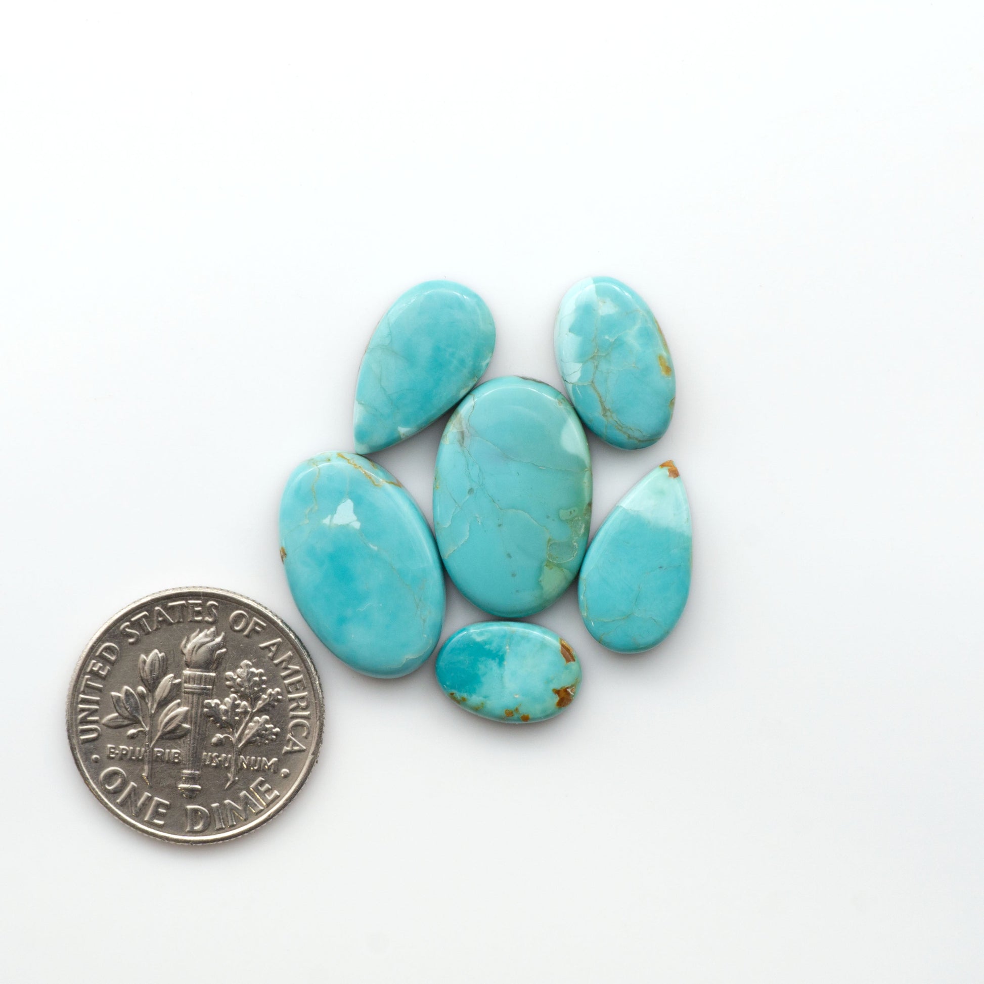Add a touch of beauty to your collection with our stunning Pilot Mountain Turquoise Cabochons. Perfect for jewelry making each piece is truly one-of-a-kind.

