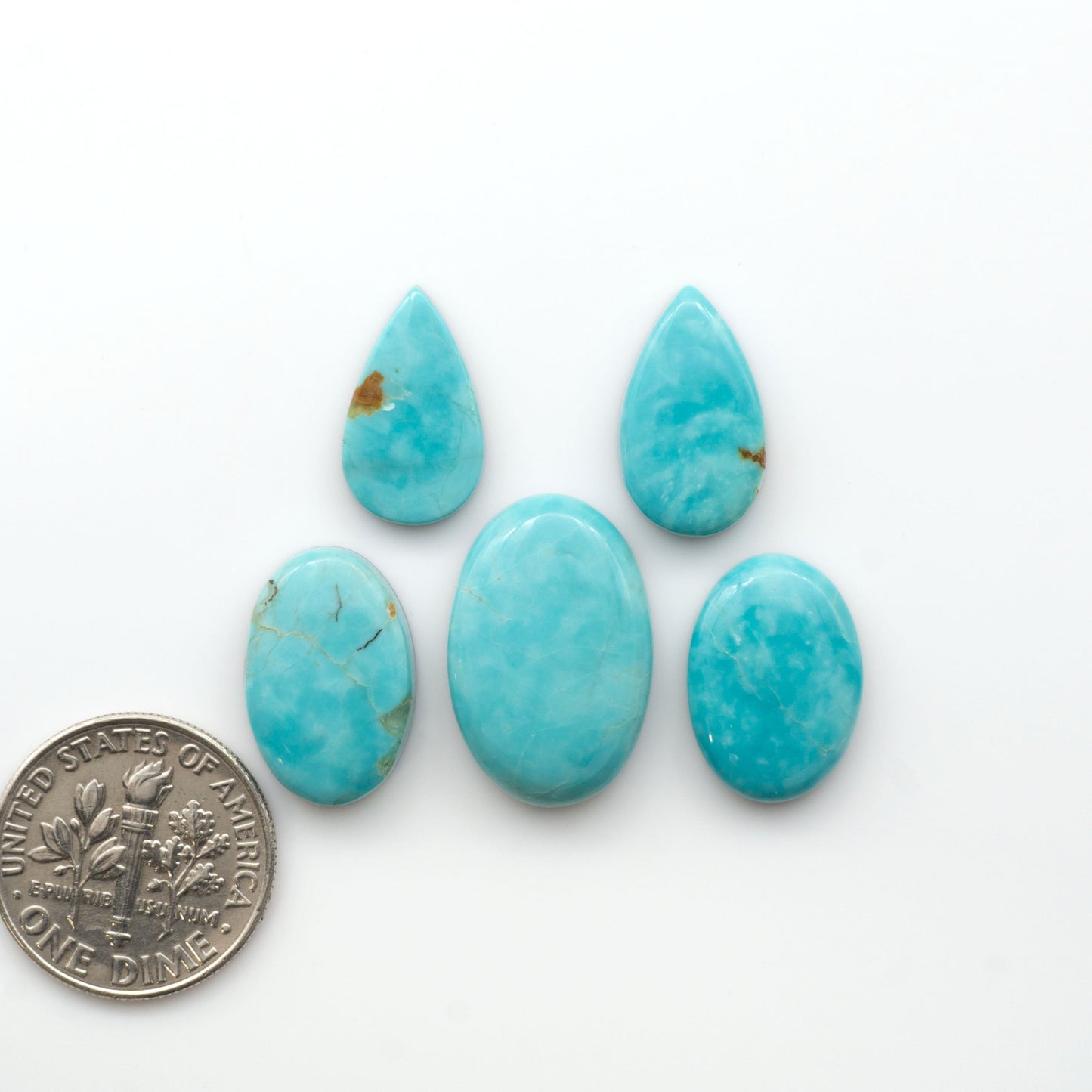 Add a touch of beauty to your collection with our stunning Pilot Mountain Turquoise Cabochons. Perfect for jewelry making each piece is truly one-of-a-kind.

