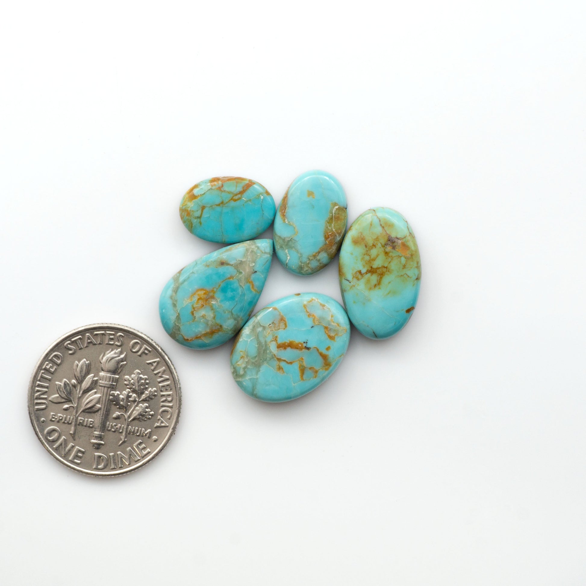 Add a touch of beauty to your collection with our stunning Pilot Mountain Turquoise Cabochons. Perfect for jewelry making each piece is truly one-of-a-kind.

