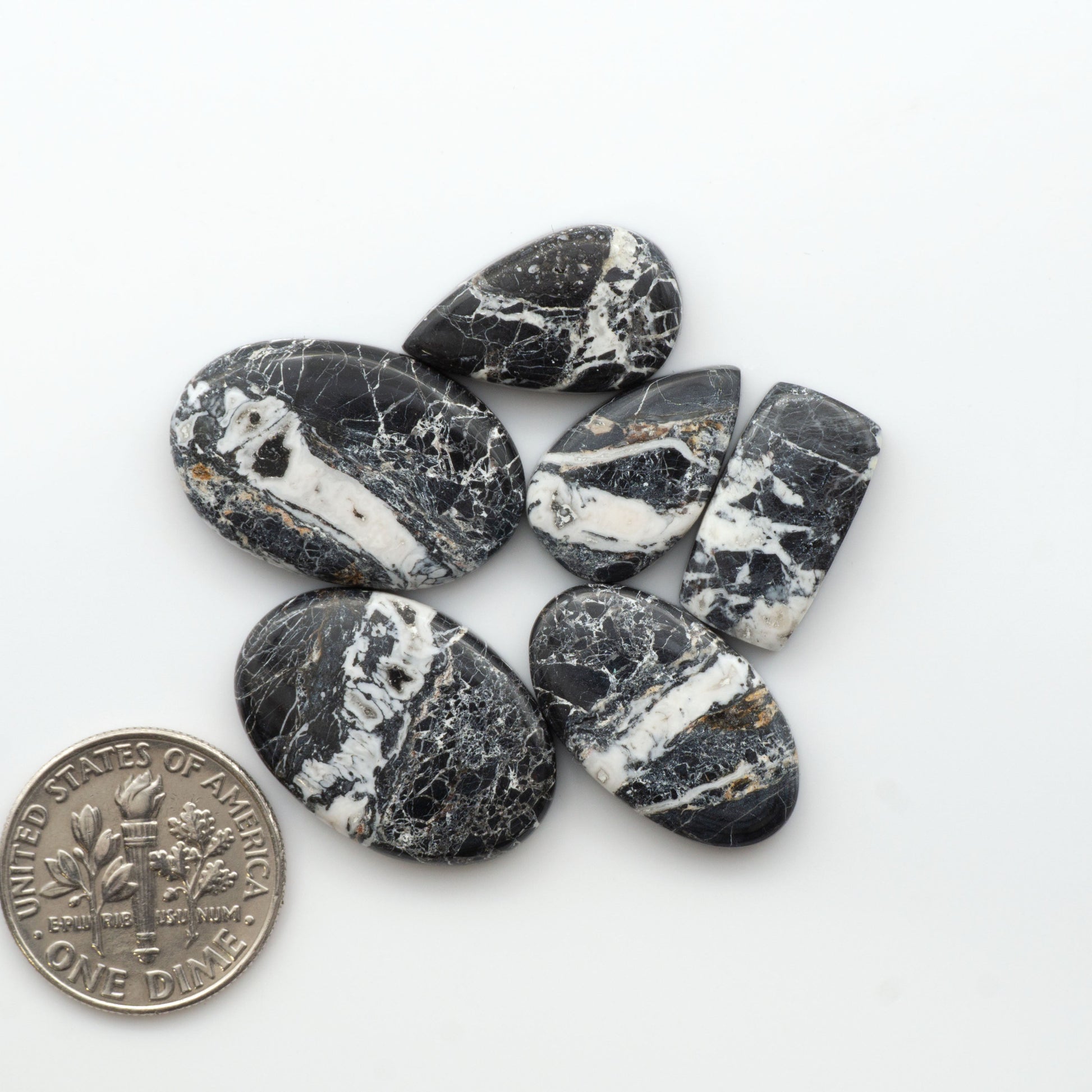 Natural White Buffalo Stone Cabochons are semi-precious gemstones cut into shapes ideal for jewelry-making, making them an excellent choice for artisans.