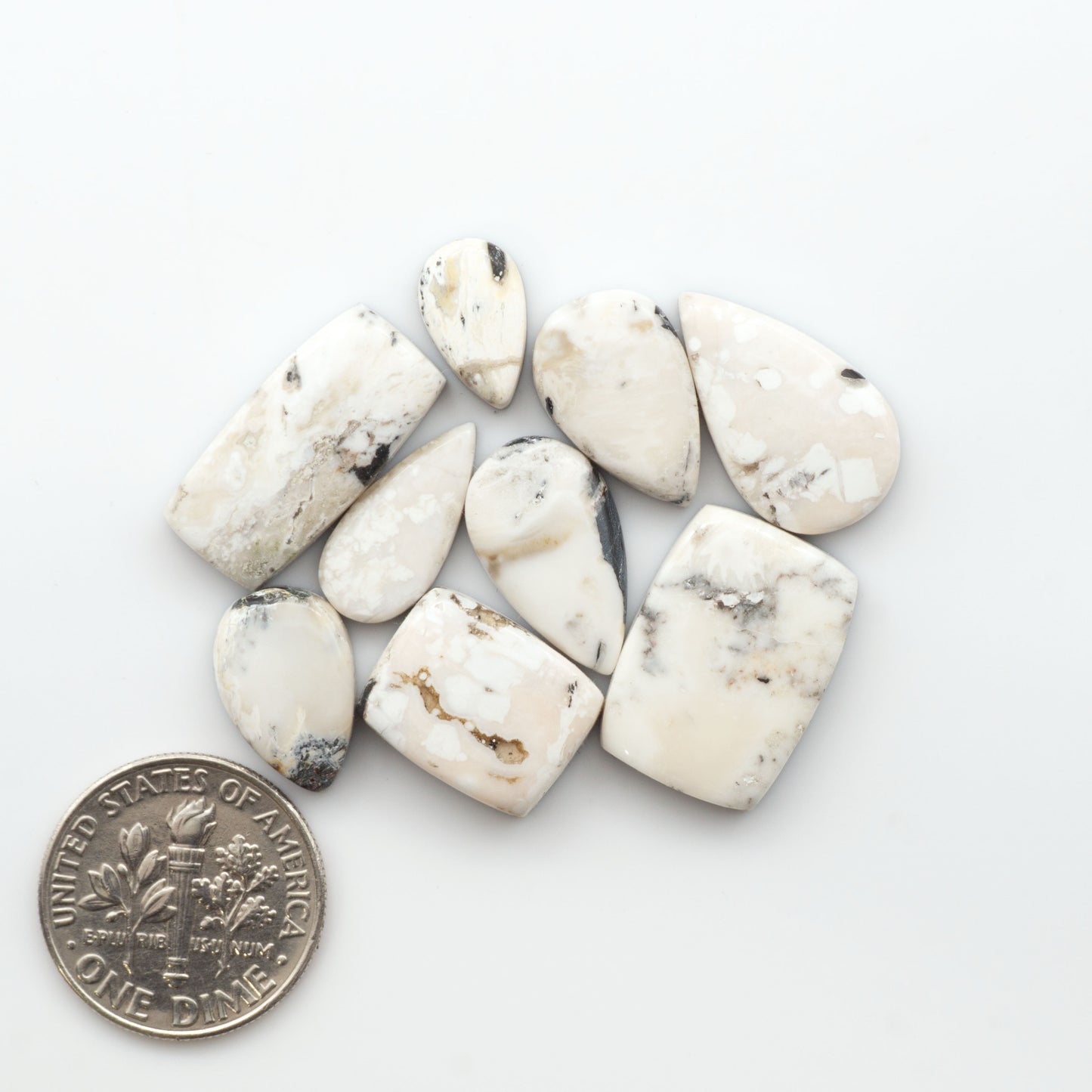 Natural White Buffalo Stone Cabochons are semi-precious gemstones cut into shapes ideal for jewelry-making, making them an excellent choice for artisans.
