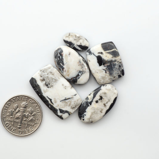 Natural White Buffalo Stone Cabochons are semi-precious gemstones cut into shapes ideal for jewelry-making, making them an excellent choice for artisans.