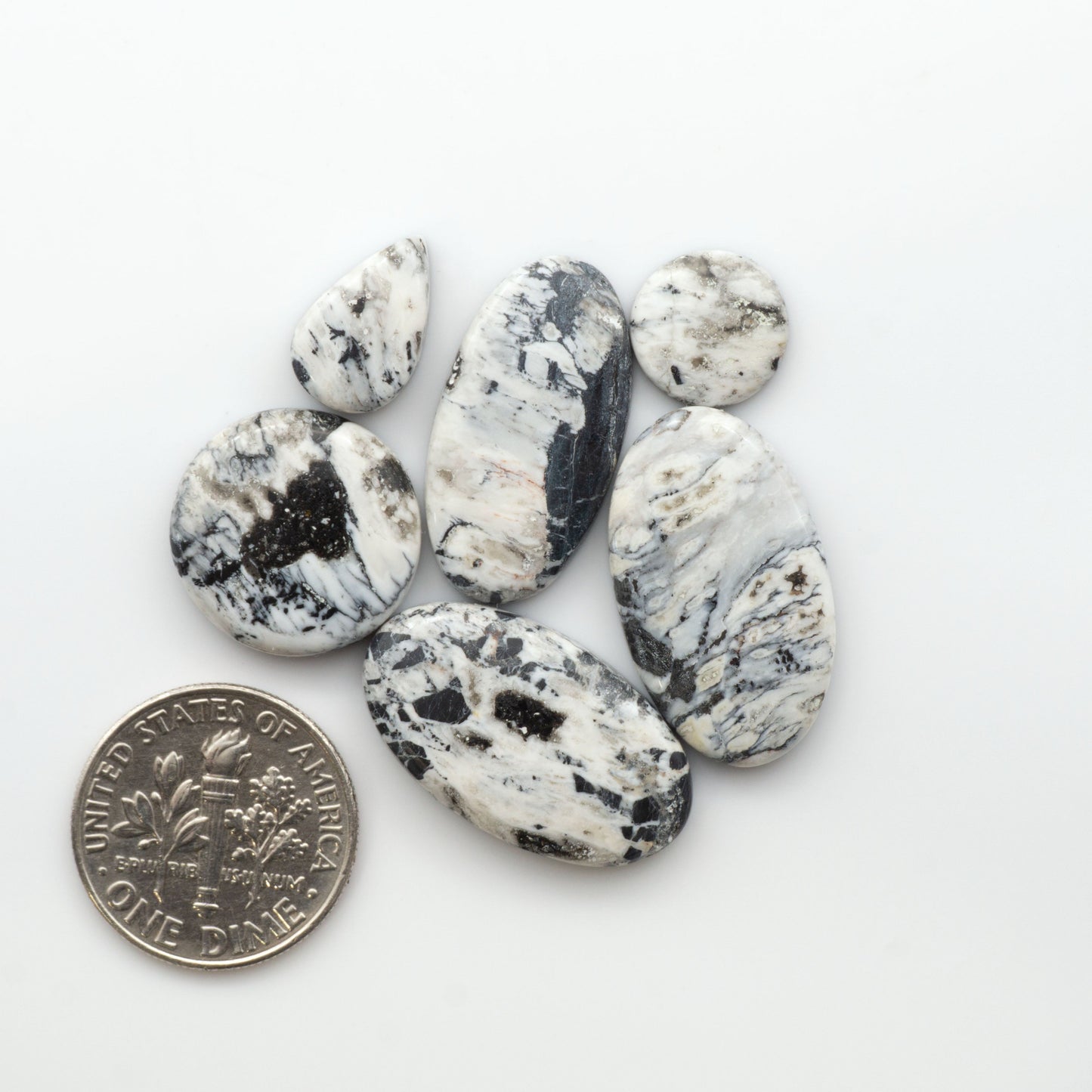 Natural White Buffalo Stone Cabochons are semi-precious gemstones cut into shapes ideal for jewelry-making, making them an excellent choice for artisans.