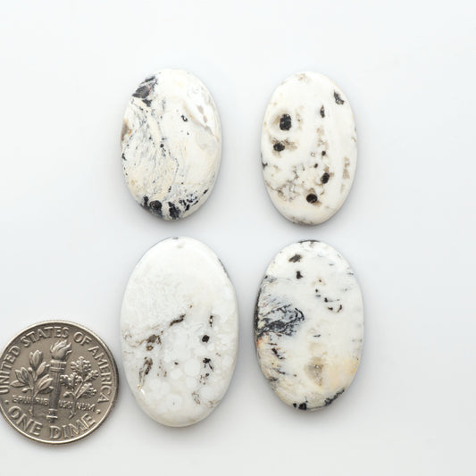 Natural White Buffalo Stone Cabochons are semi-precious gemstones cut into shapes ideal for jewelry-making, making them an excellent choice for artisans.