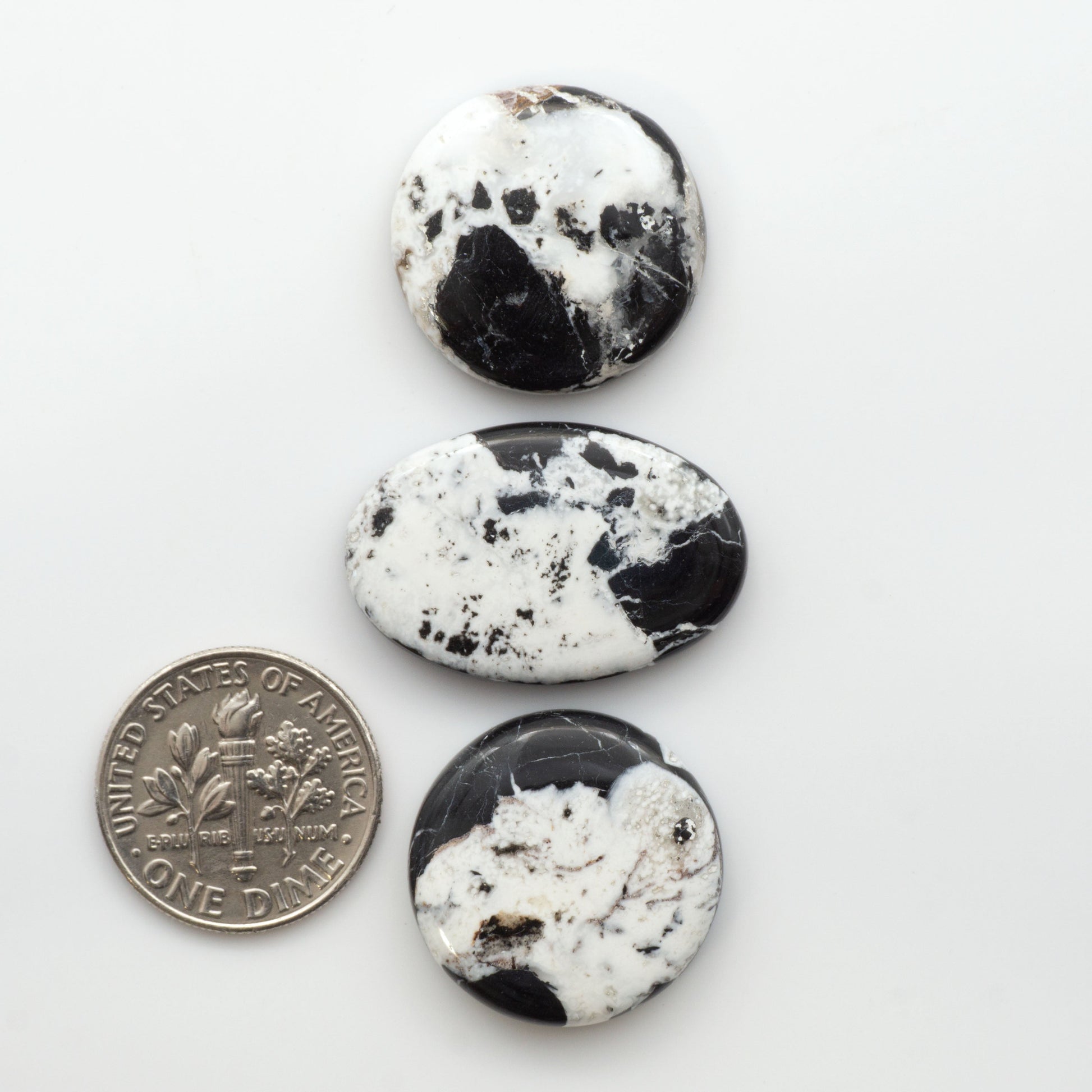 Natural White Buffalo Stone Cabochons are semi-precious gemstones cut into shapes ideal for jewelry-making, making them an excellent choice for artisans.