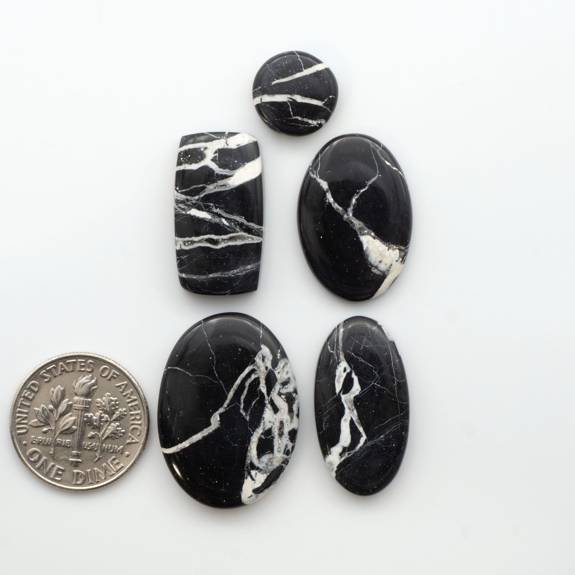 Natural White Buffalo Stone Cabochons are semi-precious gemstones cut into shapes ideal for jewelry-making, making them an excellent choice for artisans.