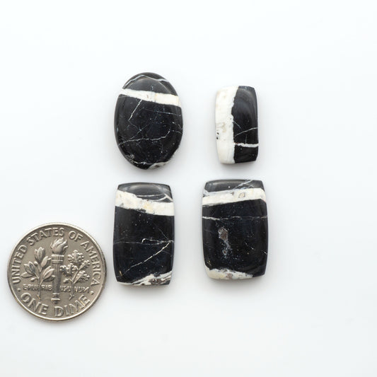 Natural White Buffalo Stone Cabochons are semi-precious gemstones cut into shapes ideal for jewelry-making, making them an excellent choice for artisans.