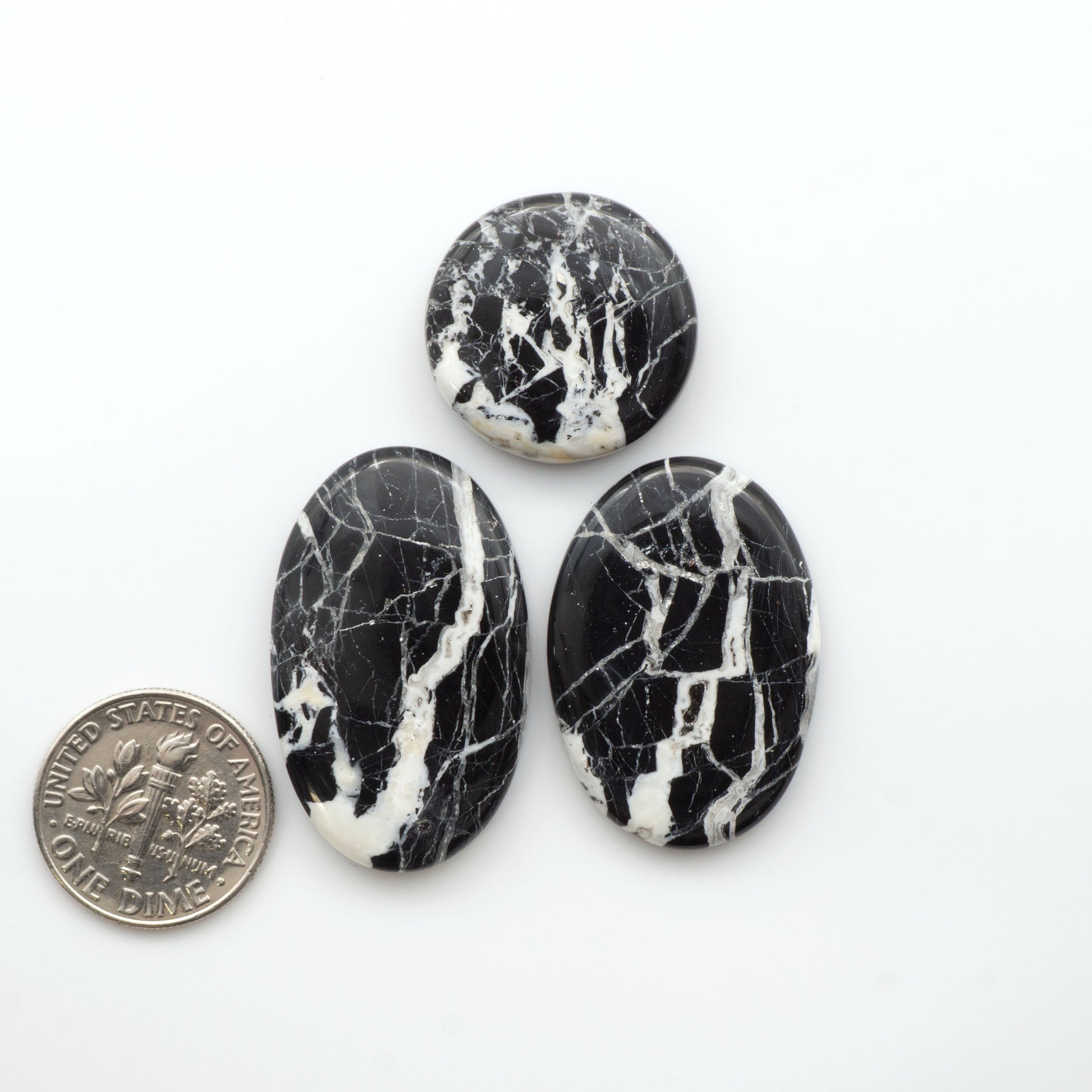 Natural White Buffalo Stone Cabochons are semi-precious gemstones cut into shapes ideal for jewelry-making, making them an excellent choice for artisans.