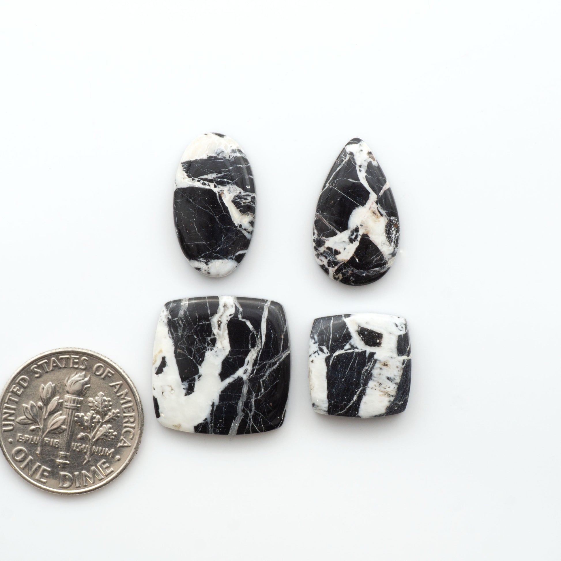 Natural White Buffalo Stone Cabochons are semi-precious gemstones cut into shapes ideal for jewelry-making, making them an excellent choice for artisans.