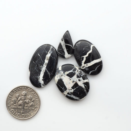Natural White Buffalo Stone Cabochons are semi-precious gemstones cut into shapes ideal for jewelry-making, making them an excellent choice for artisans.
