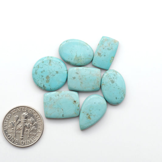 Add a touch of beauty to your collection with our stunning Pilot Mountain Turquoise Cabochons. Perfect for jewelry making each piece is truly one-of-a-kind.
