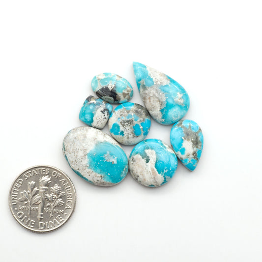 White Water Turquoise Cabochons with their mesmerizing patterns and one-of-a-kind colors, are perfect for those looking for a unique and eye-catching piece.
