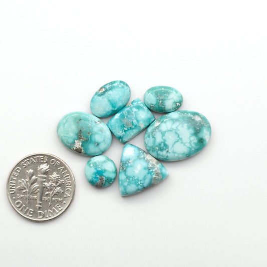 White Water Turquoise Cabochons with their mesmerizing patterns and one-of-a-kind colors, are perfect for those looking for a unique and eye-catching piece.