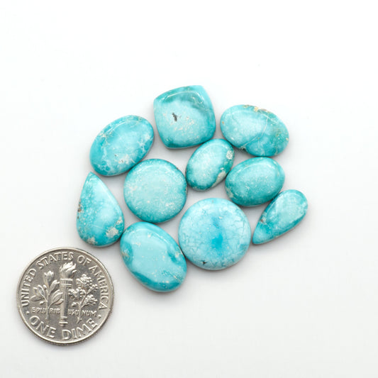 White Water Turquoise Cabochons with their mesmerizing patterns and one-of-a-kind colors, are perfect for those looking for a unique and eye-catching piece.
