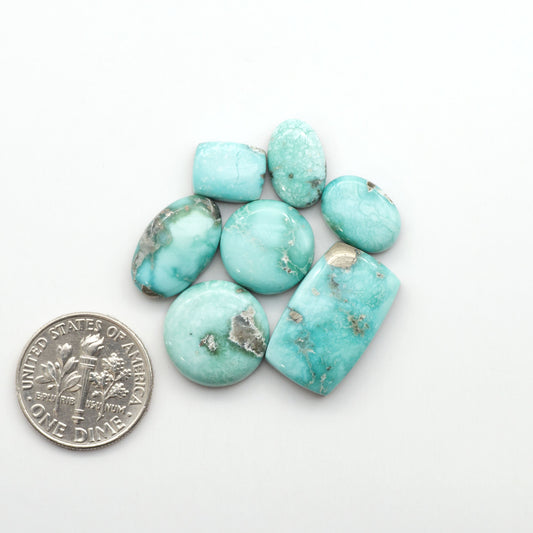 White Water Turquoise Cabochons with their mesmerizing patterns and one-of-a-kind colors, are perfect for those looking for a unique and eye-catching piece.