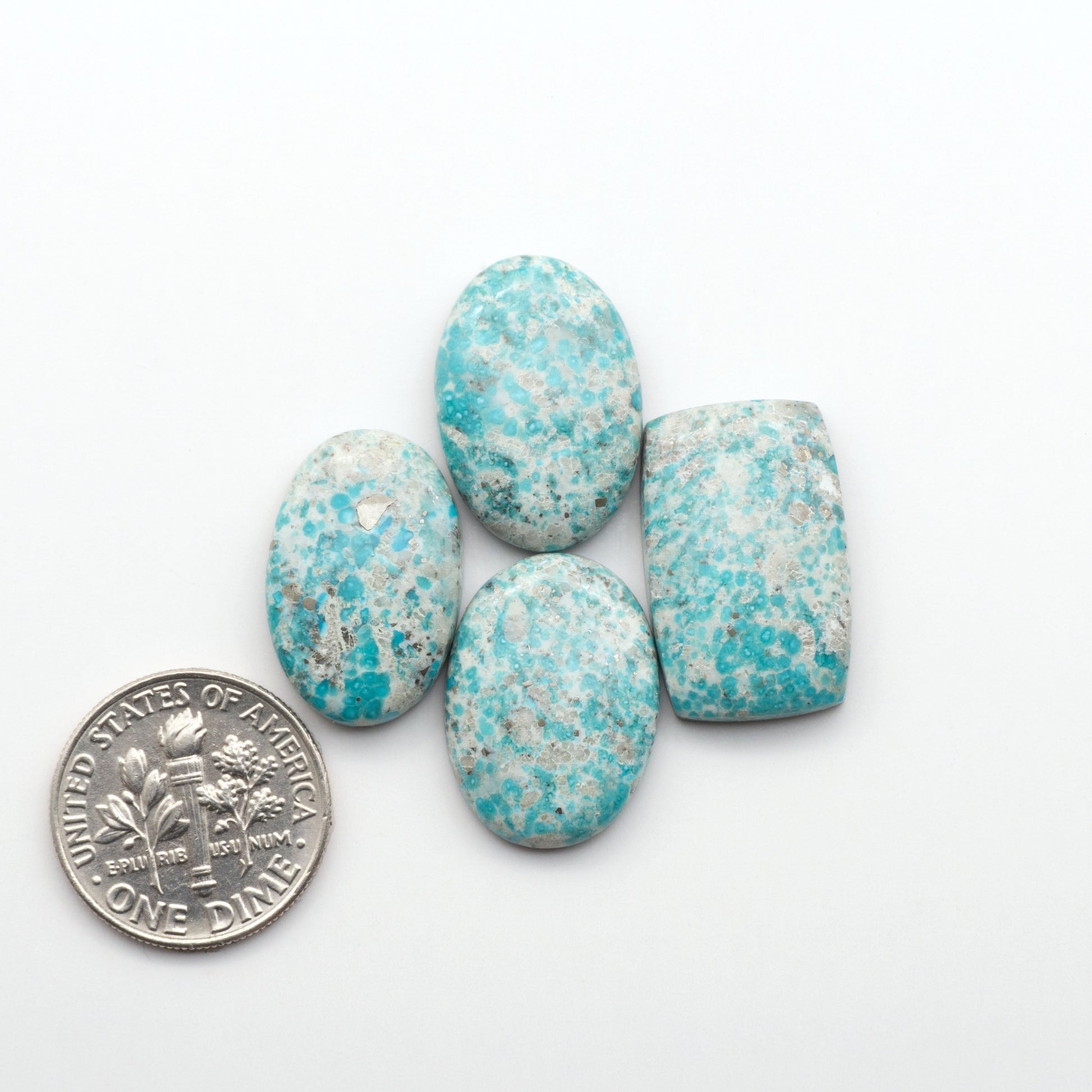 White Water Turquoise Cabochons with their mesmerizing patterns and one-of-a-kind colors, are perfect for those looking for a unique and eye-catching piece.