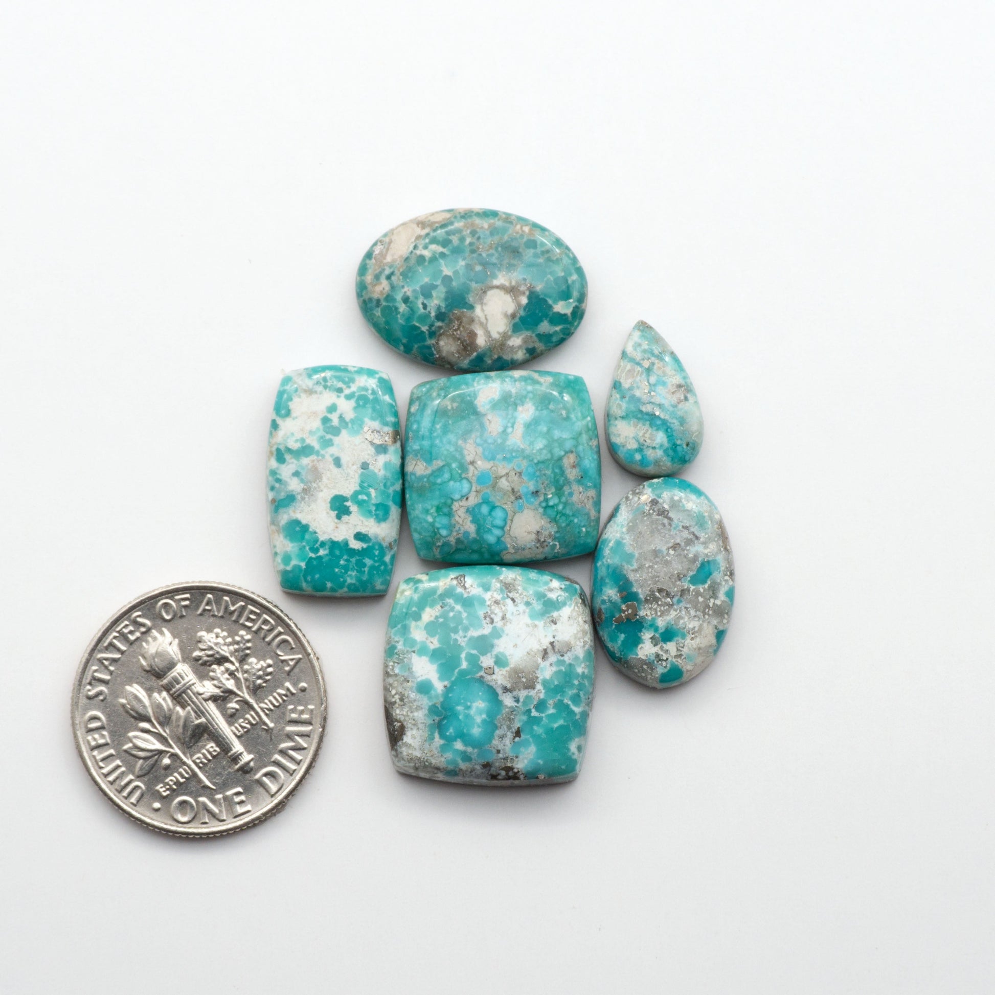 White Water Turquoise Cabochons with their mesmerizing patterns and one-of-a-kind colors, are perfect for those looking for a unique and eye-catching piece.