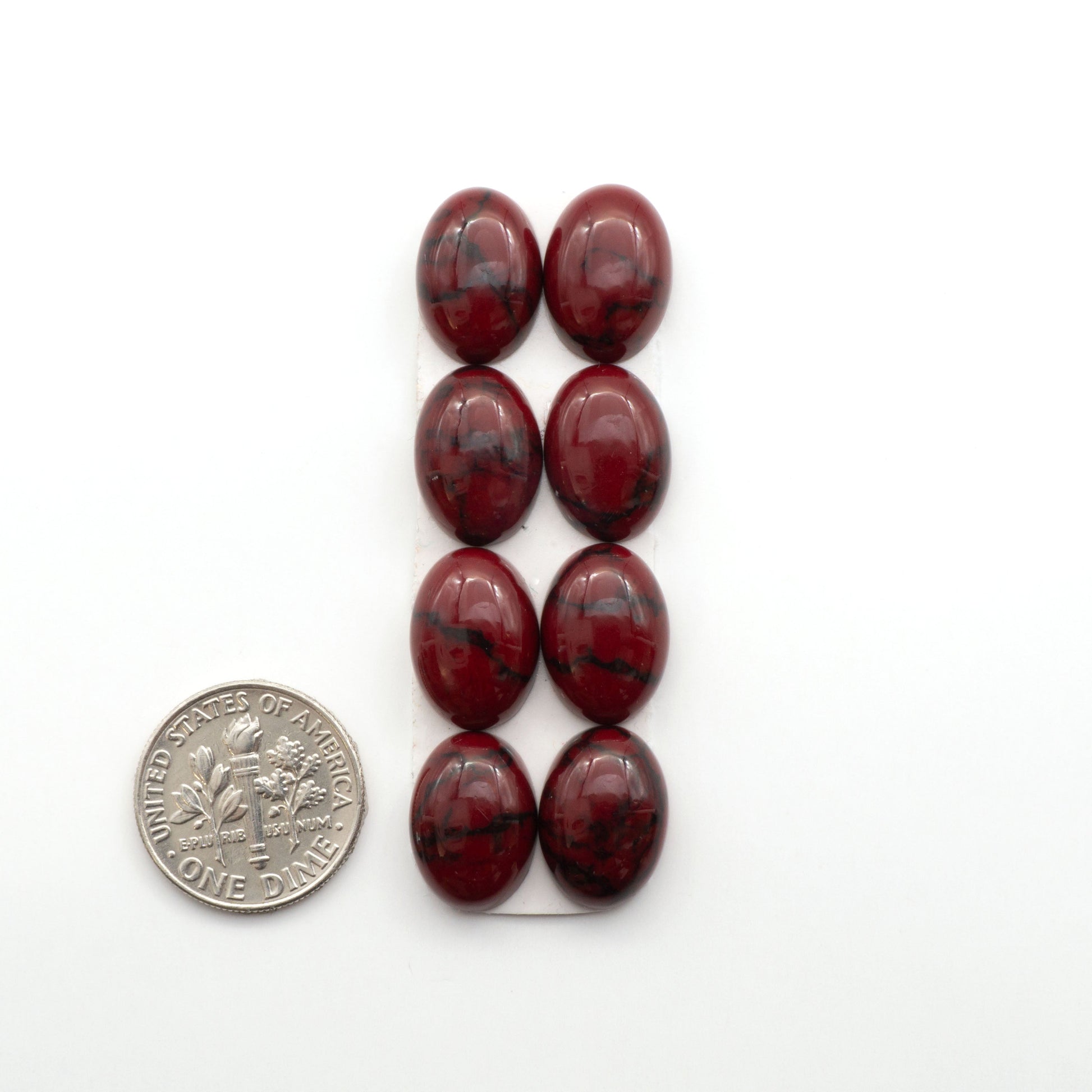 Bloody Bison Jasper is a composite stone with a vibrant red hue and black matrix that creates a strong impression and a touch of opulence to any jewelry piece.