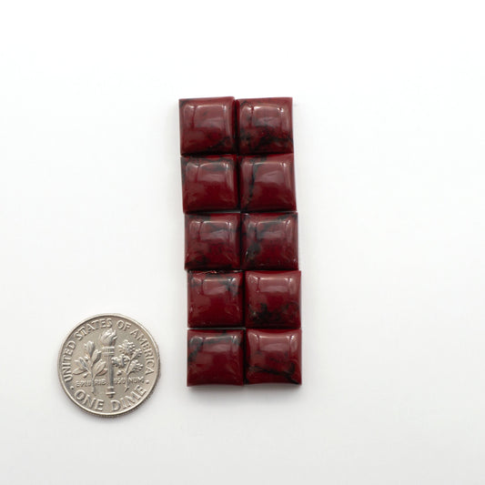 Bloody Bison Jasper is a composite stone with a vibrant red hue and black matrix that creates a strong impression and a touch of opulence to any jewelry piece.
