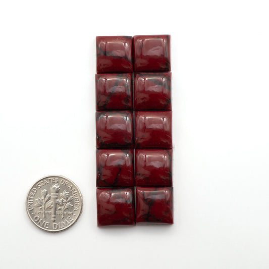 Bloody Bison Jasper is a composite stone with a vibrant red hue and black matrix that creates a strong impression and a touch of opulence to any jewelry piece.