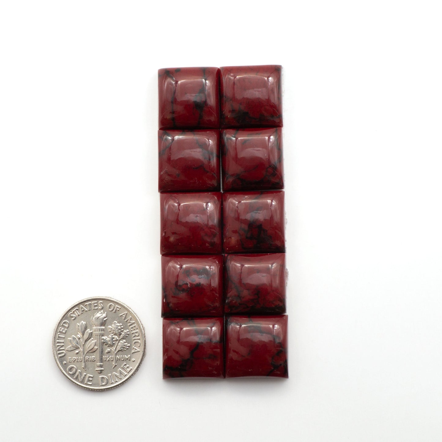 Bloody Bison Jasper is a composite stone with a vibrant red hue and black matrix that creates a strong impression and a touch of opulence to any jewelry piece.